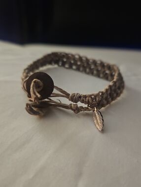 Handwoven Brown Cord Bracelet with Feather Charm